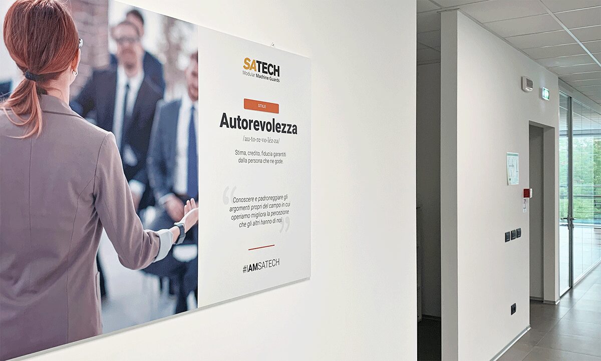 Sign hung on the wall featuring one of the values that inspires Satech's Company Culture