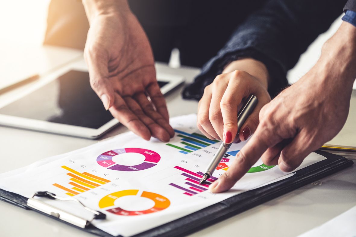 Hand pointing at graph depicting the ROI (Return on Investment) of installing OSHA compliant fences by Satech