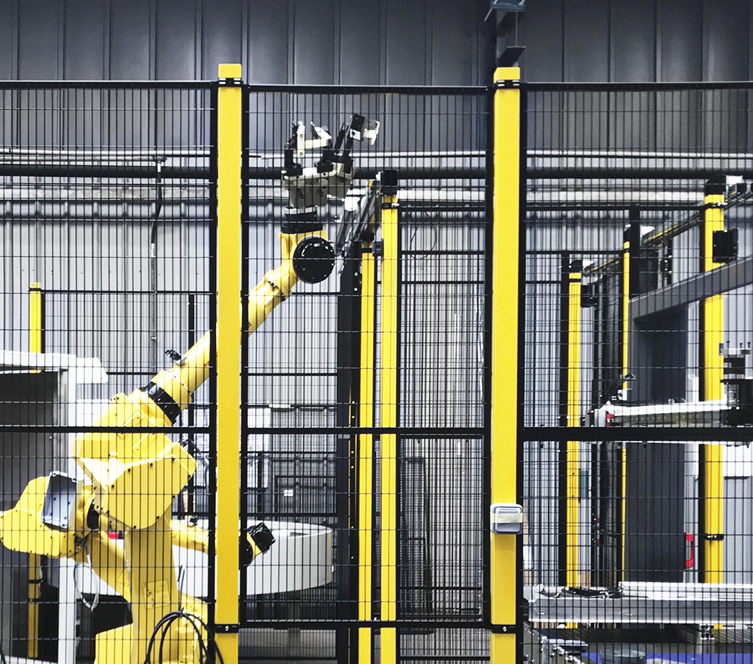 Picture of Satech STRONG System inside an industrial facility protecting antropomorphic robots