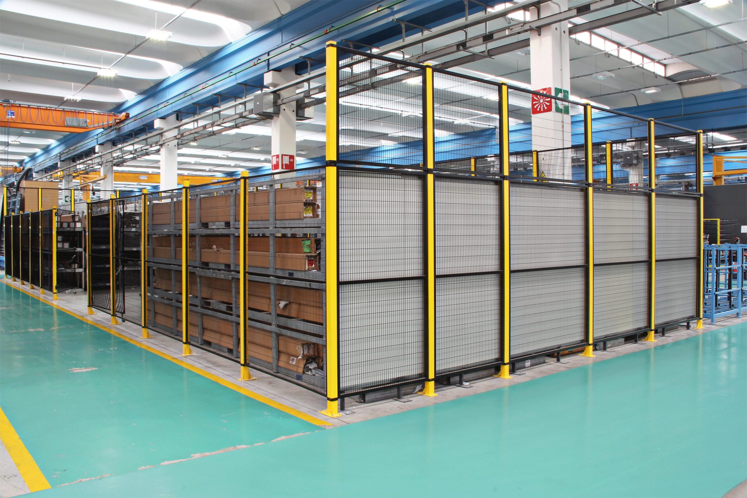 Picture of a perimeter line featuring Satech STRONG Machine Guards surrounding an industrial facility